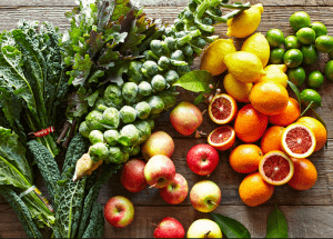 a group of fruits and vegetables on a wood surface Healthy Weight Loss Diets Doncaster