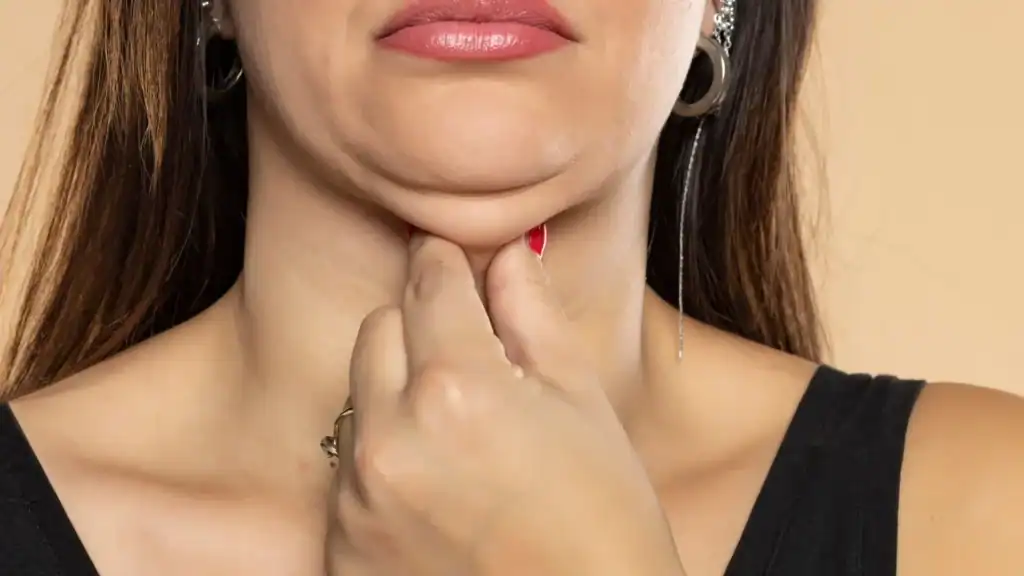 An image of a woman with double chin, sad, worried : Non Surgical Double Chin Removal Treatment in Doncaster, UK