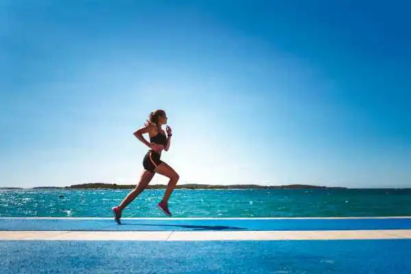 Woman running showing strong leg muscle Doncaster